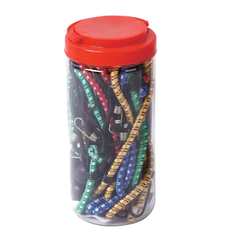 Assorted climbing chalk tubes in a clear container with a red lid, used for improving grip during rock climbing and bouldering activities.