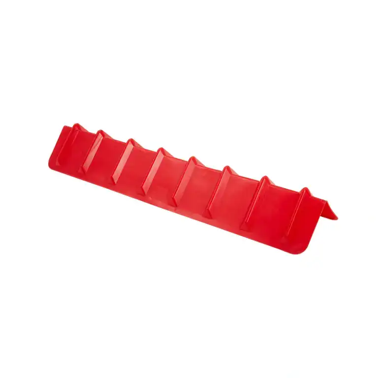 Red plastic cable management tool with multiple slots for organizing electrical cords and preventing tangles.
