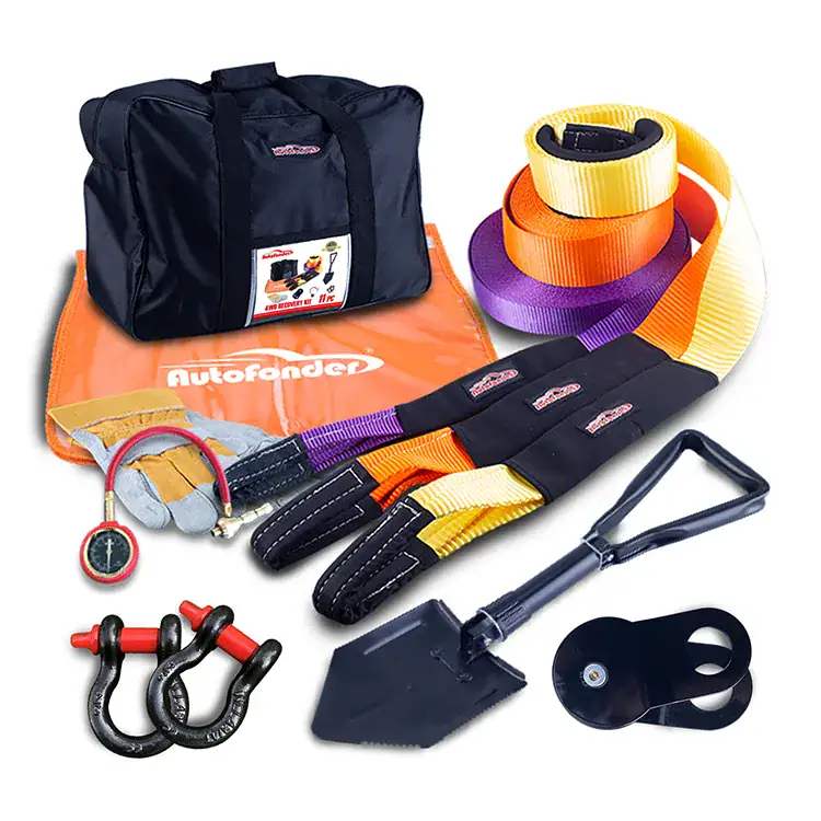 High-quality vehicle recovery kit including tow straps, D-shackles, a shovel, and a carrying bag, designed for safe and efficient vehicle rescue and off-road recovery.