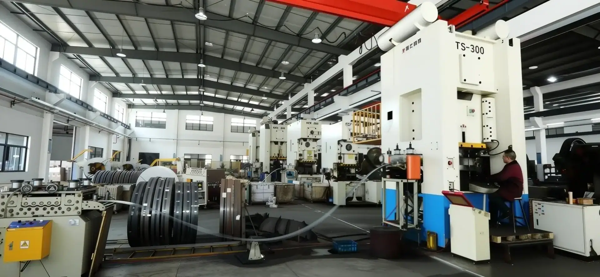 Advanced industrial machinery used for manufacturing large metal components in a modern factory setting.